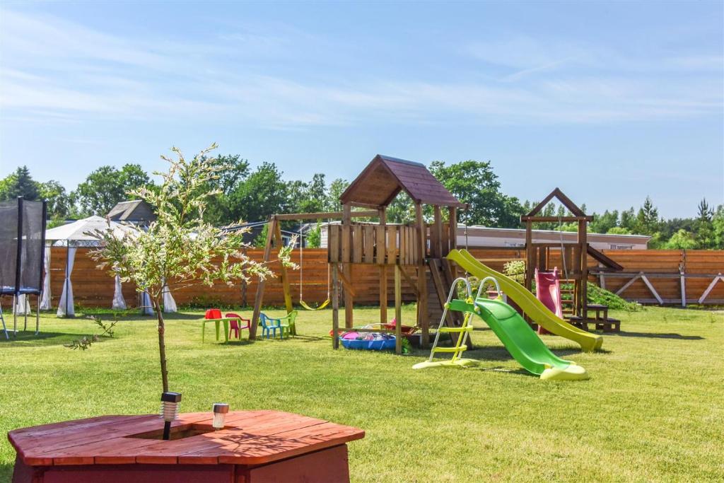 a park with a playground with a slide at Ardonas in Šventoji