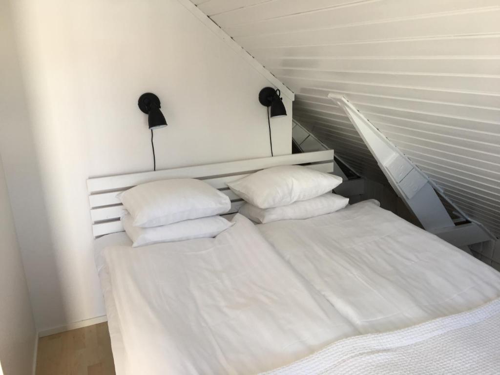 Postel nebo postele na pokoji v ubytování Harbour House