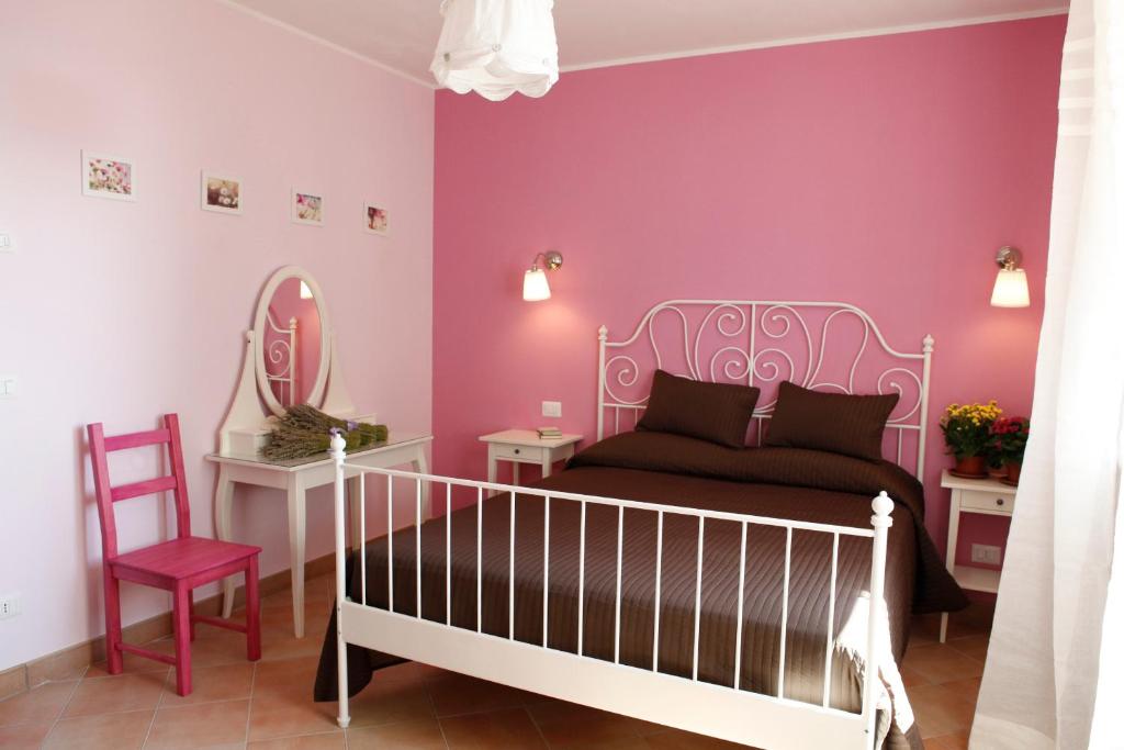 Ein Bett oder Betten in einem Zimmer der Unterkunft B&B Lavanda e Rosmarino