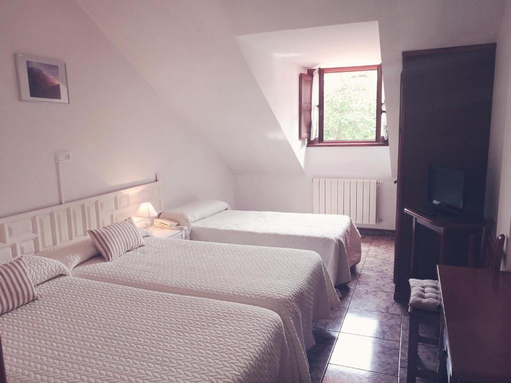 Cama o camas de una habitación en Hotel Solatorre