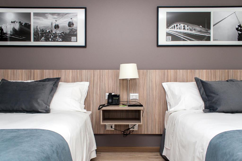 Postel nebo postele na pokoji v ubytování Hotel Capital Bellet