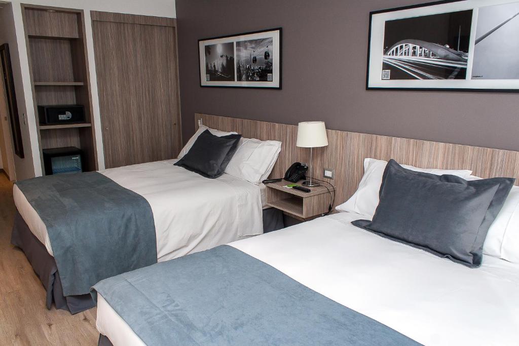 Postel nebo postele na pokoji v ubytování Hotel Capital Bellet