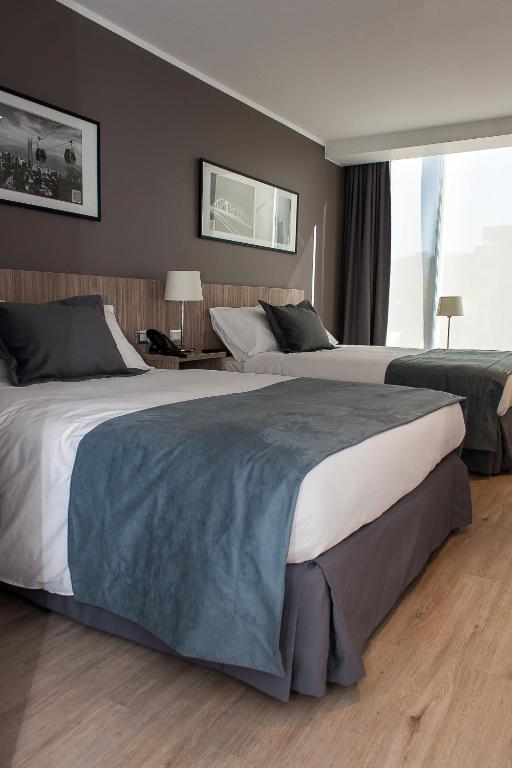 Postel nebo postele na pokoji v ubytování Hotel Capital Bellet