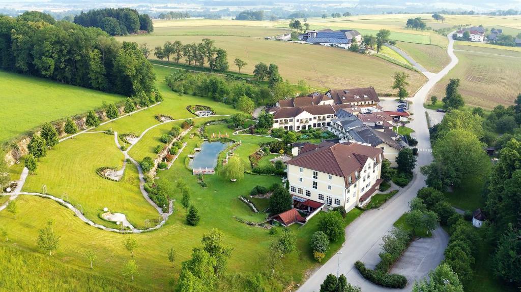 an aerial view of a house in a green field at RelaxResort Kothmühle in Neuhofen an der Ybbs