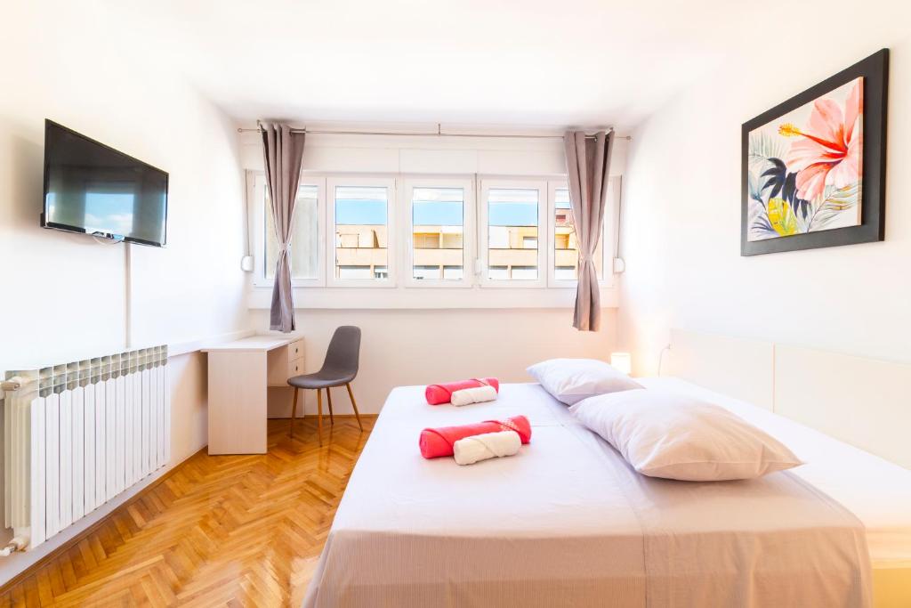 En eller flere senge i et værelse på Your Vacation Apartment