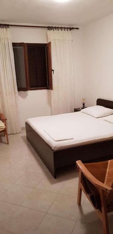 Postel nebo postele na pokoji v ubytování Apartmani Ivanka Simuni