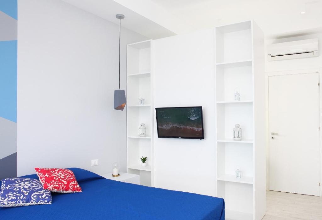 Łóżko lub łóżka w pokoju w obiekcie Sea Windows Suite