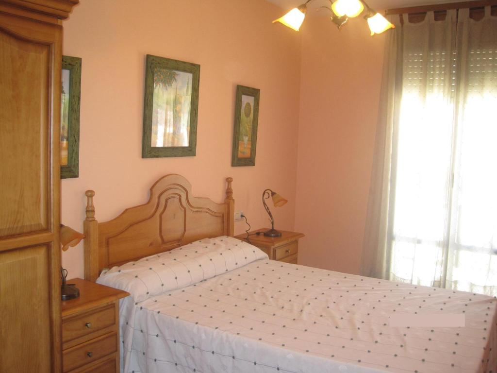 Un pat sau paturi într-o cameră la Apartamento Rural Lobo