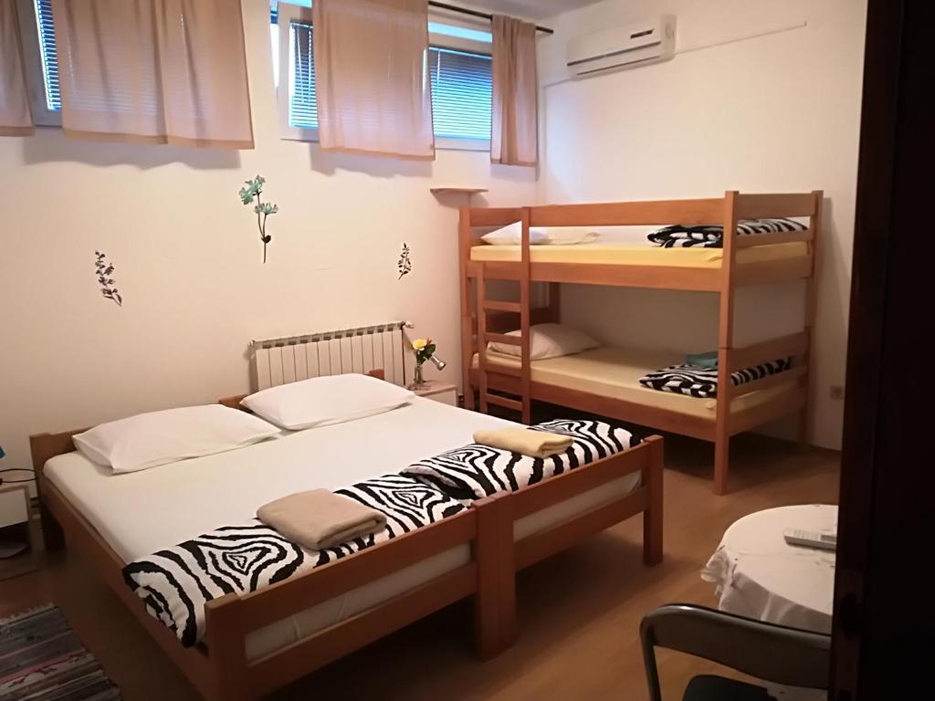 Posteľ alebo postele v izbe v ubytovaní Hostel Poslon