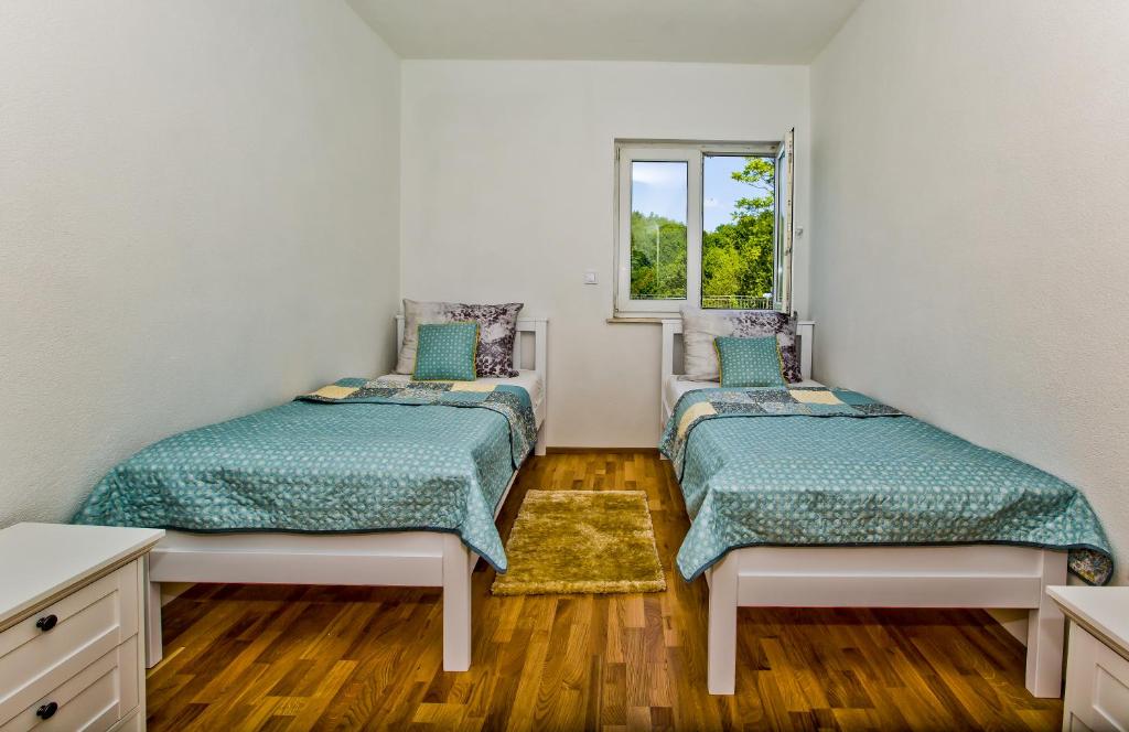 Postel nebo postele na pokoji v ubytování Forest House Silva