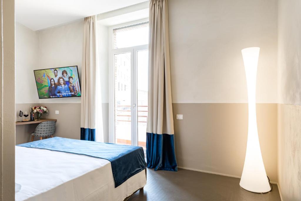 Postel nebo postele na pokoji v ubytování A World Aparts - Barberini Boutique Hotel