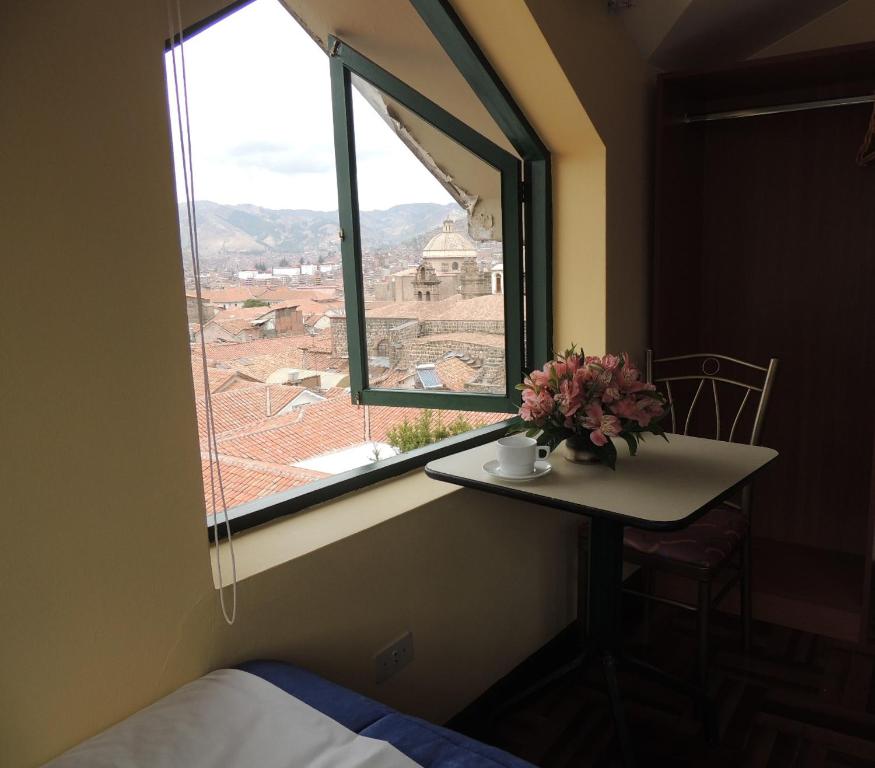 Postel nebo postele na pokoji v ubytování Cusco Plaza Nazarenas