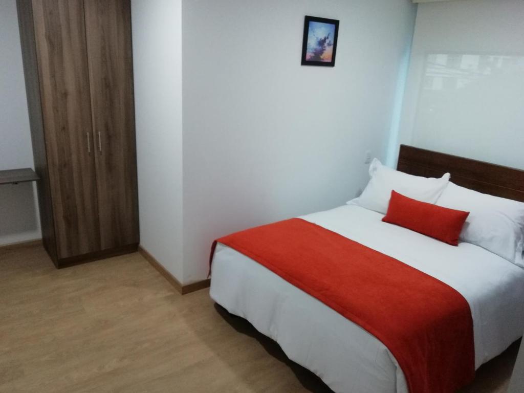 Postel nebo postele na pokoji v ubytování Hotel Portal de los Andes
