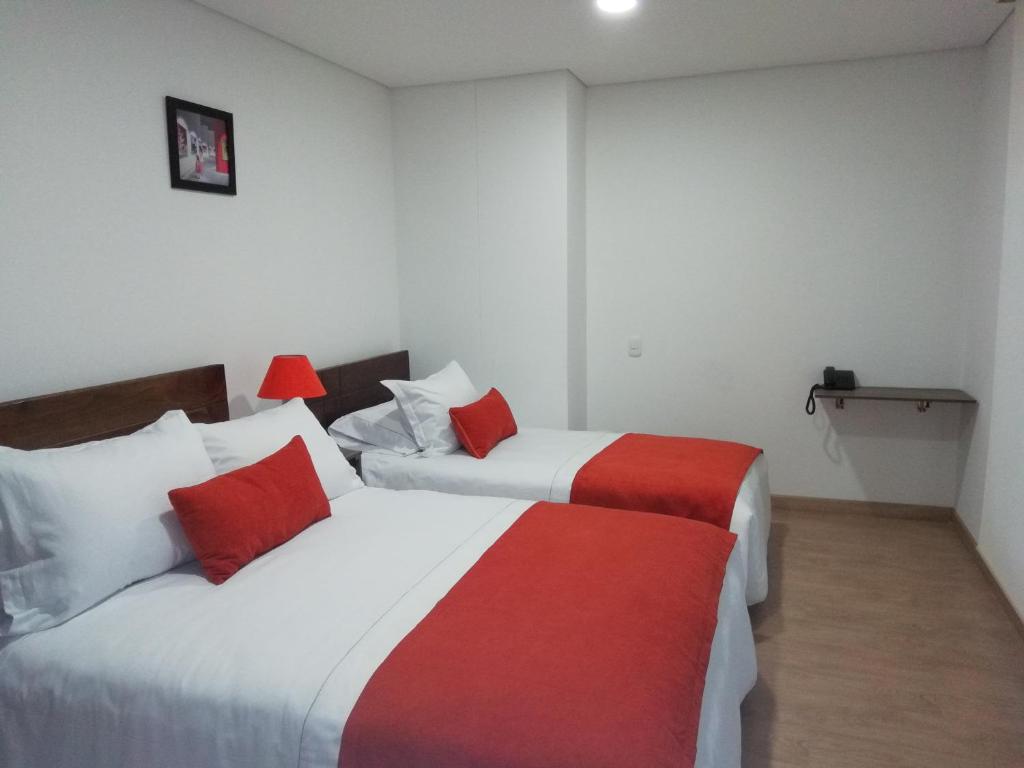 Postel nebo postele na pokoji v ubytování Hotel Portal de los Andes