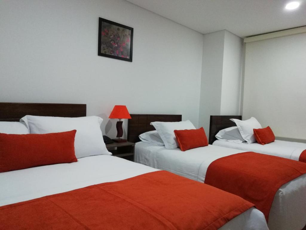 Postel nebo postele na pokoji v ubytování Hotel Portal de los Andes