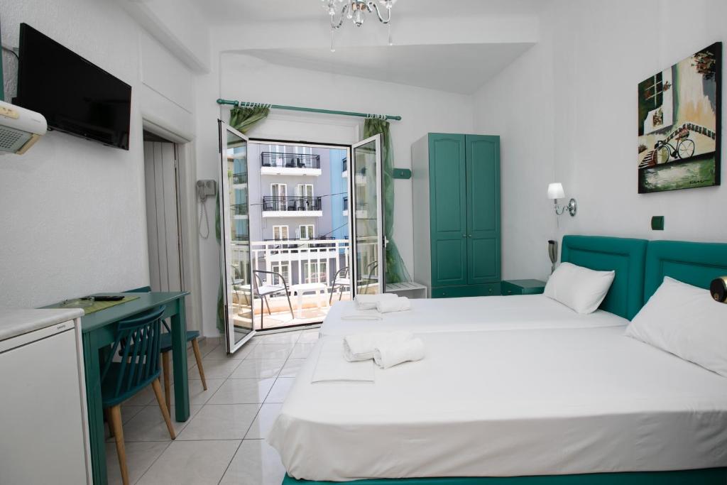 A bed or beds in a room at Kallithea Studios