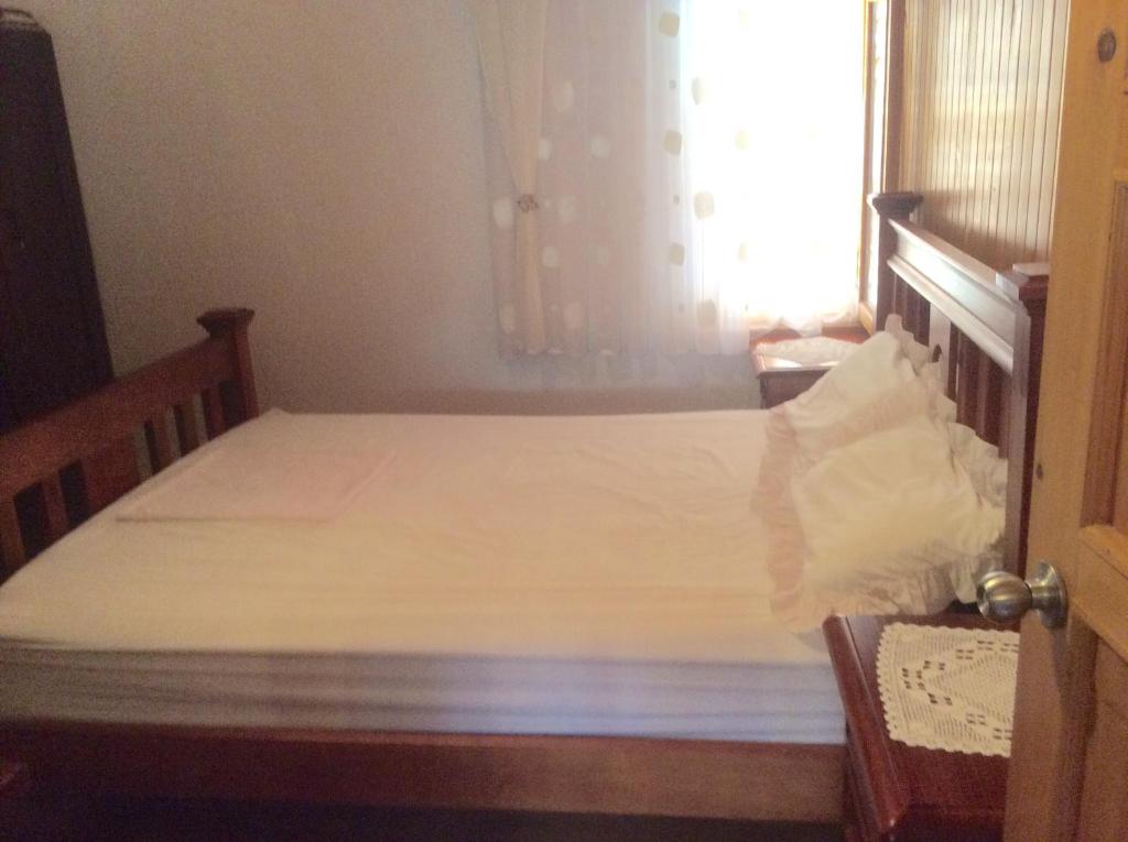 Postel nebo postele na pokoji v ubytování Apartman Nadia