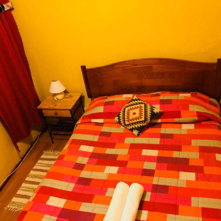 Postel nebo postele na pokoji v ubytování Hostal Intipara