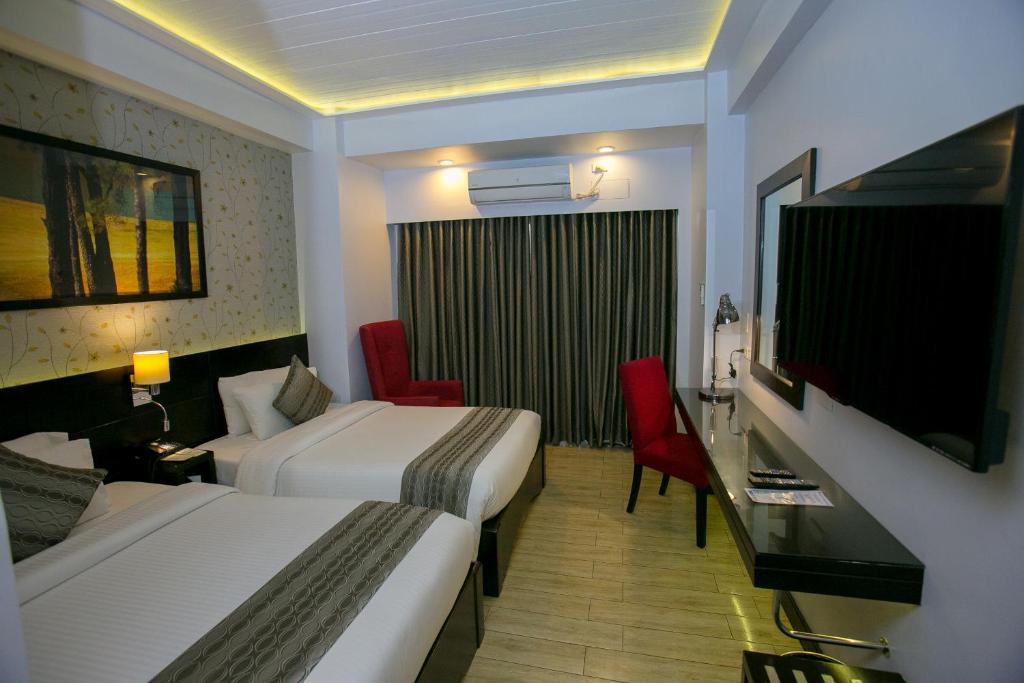 TV a/nebo společenská místnost v ubytování Venus Parkview Hotel