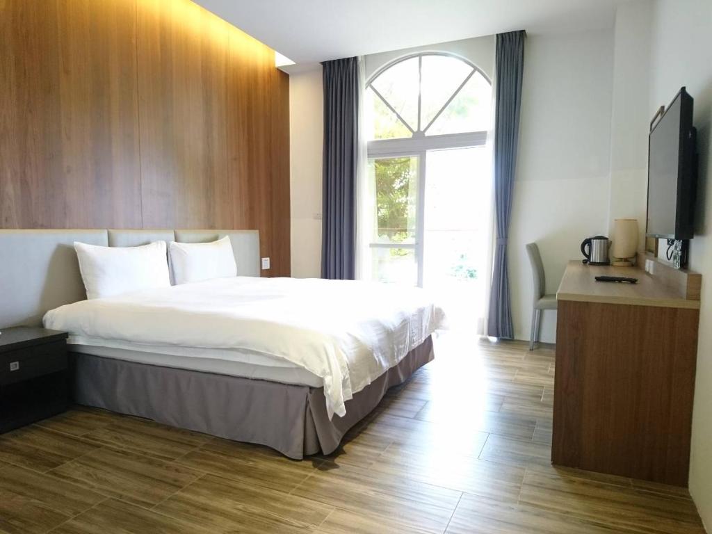 Postel nebo postele na pokoji v ubytování Hledu Hotel