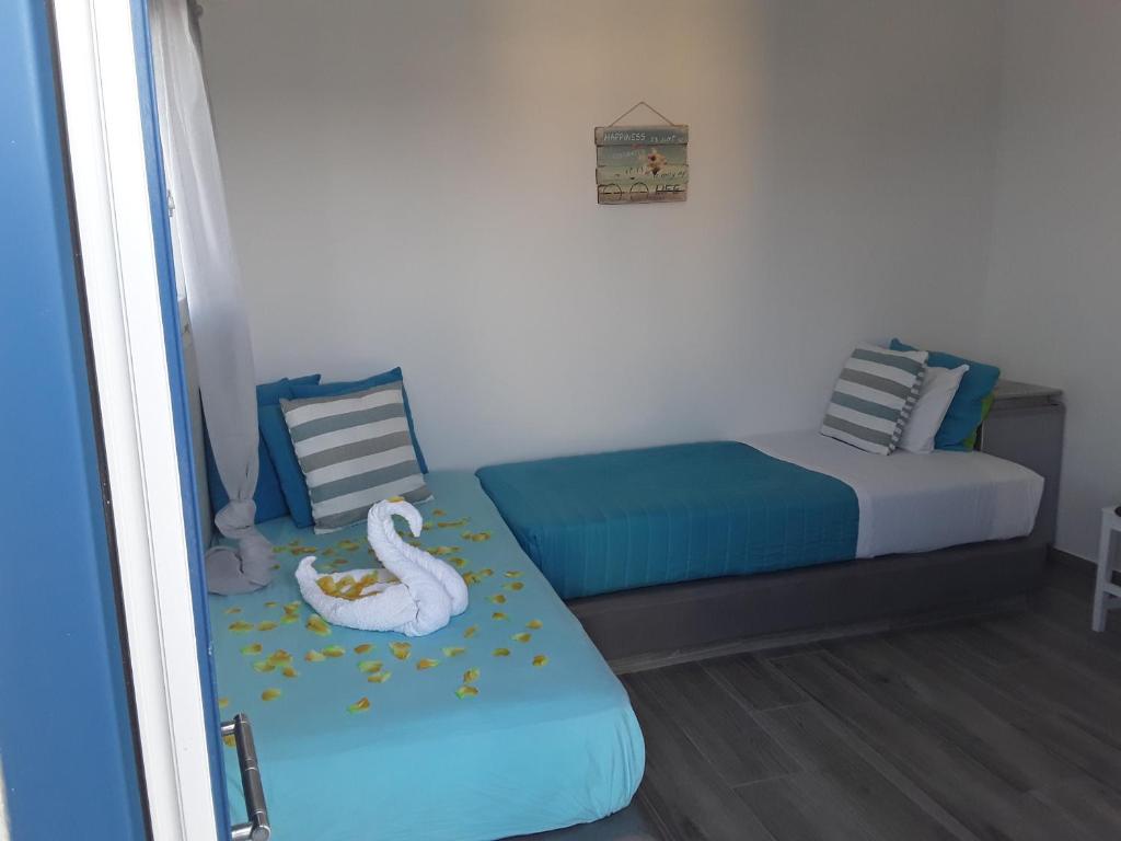 Postel nebo postele na pokoji v ubytování Azalea Hotel