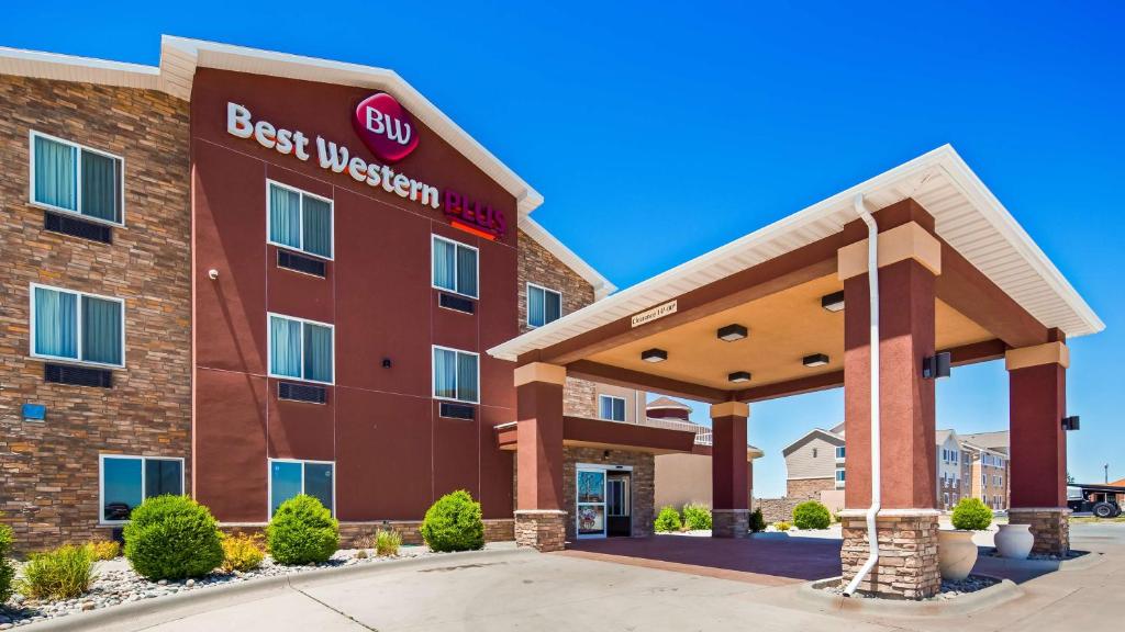 a hotel building with a best western sign on it at Best Western Plus Carousel Inn & Suites Burlington in Burlington