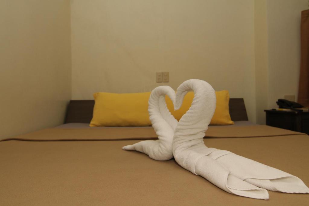 Postel nebo postele na pokoji v ubytování Casa Rosario Hotel