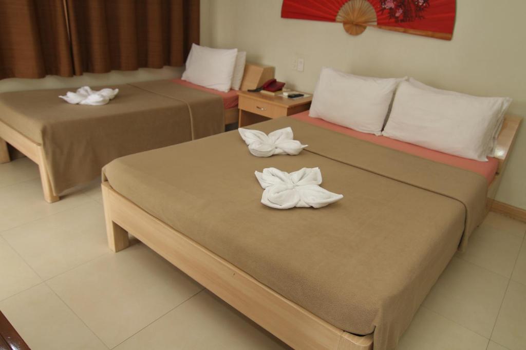 Postel nebo postele na pokoji v ubytování Casa Rosario Hotel
