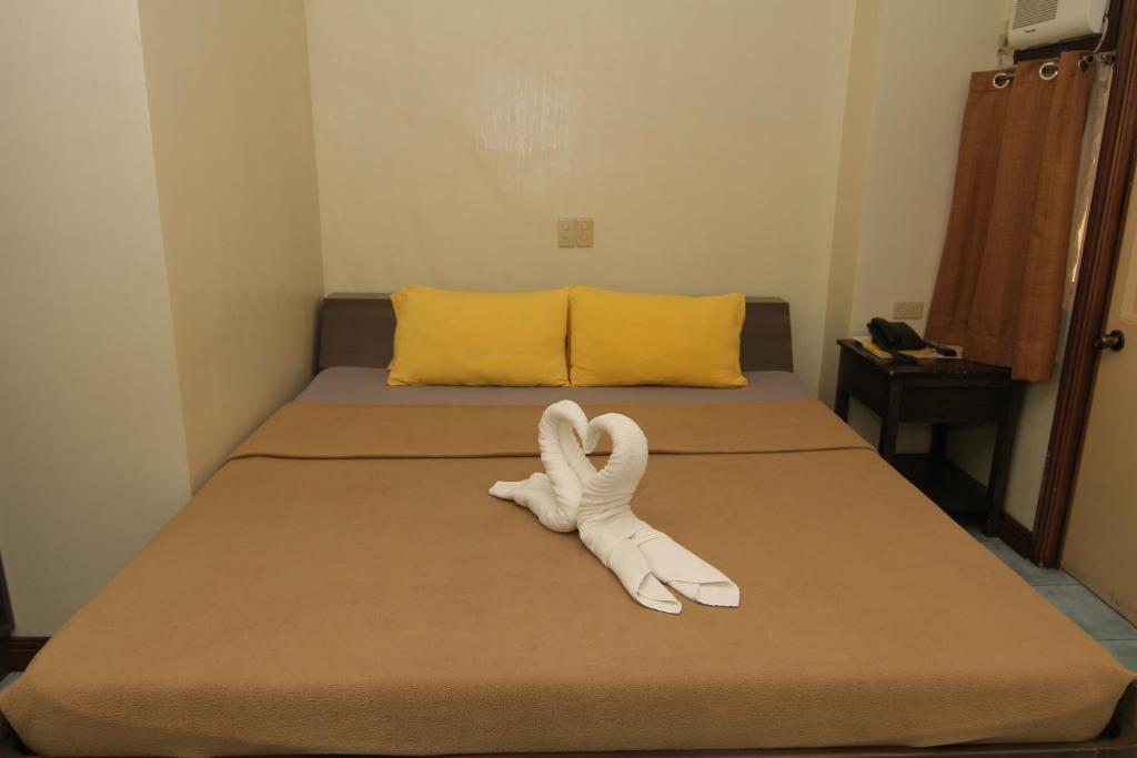 Postel nebo postele na pokoji v ubytování Casa Rosario Hotel
