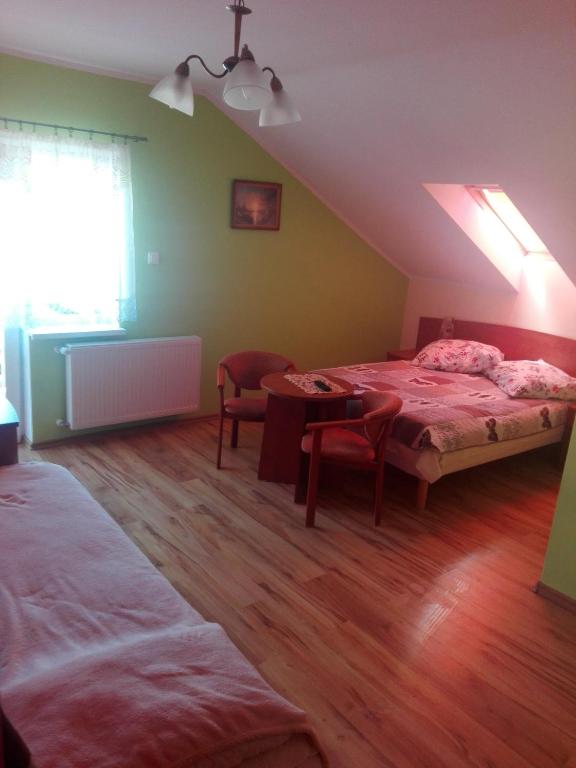 Postel nebo postele na pokoji v ubytování Pokoje Gościnne u Oli