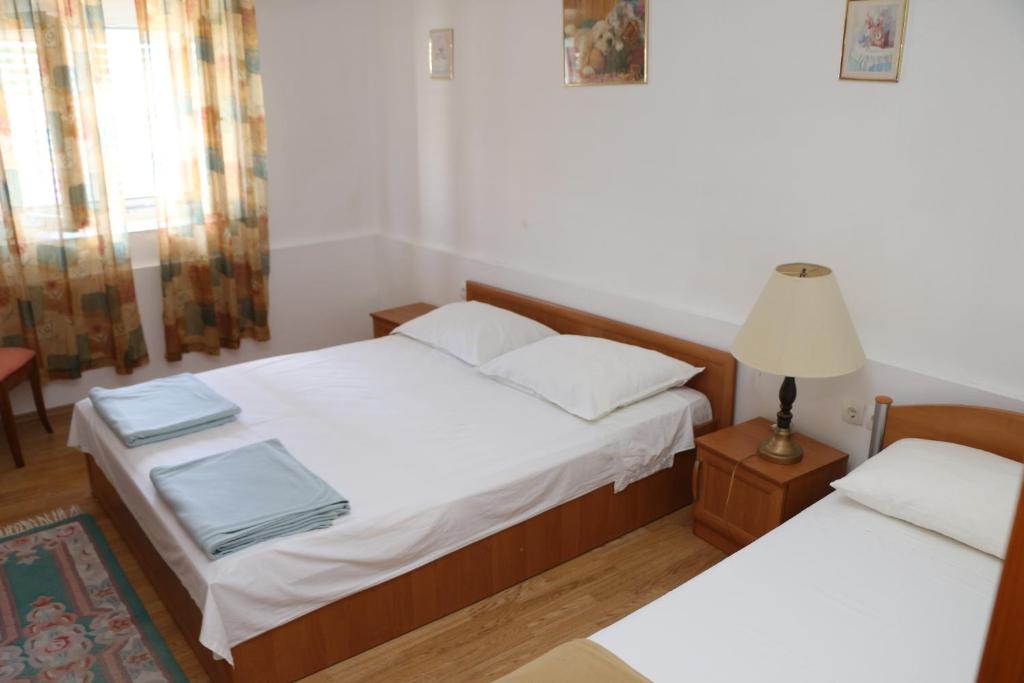 Postel nebo postele na pokoji v ubytování Apartment Grgas-Tucilo