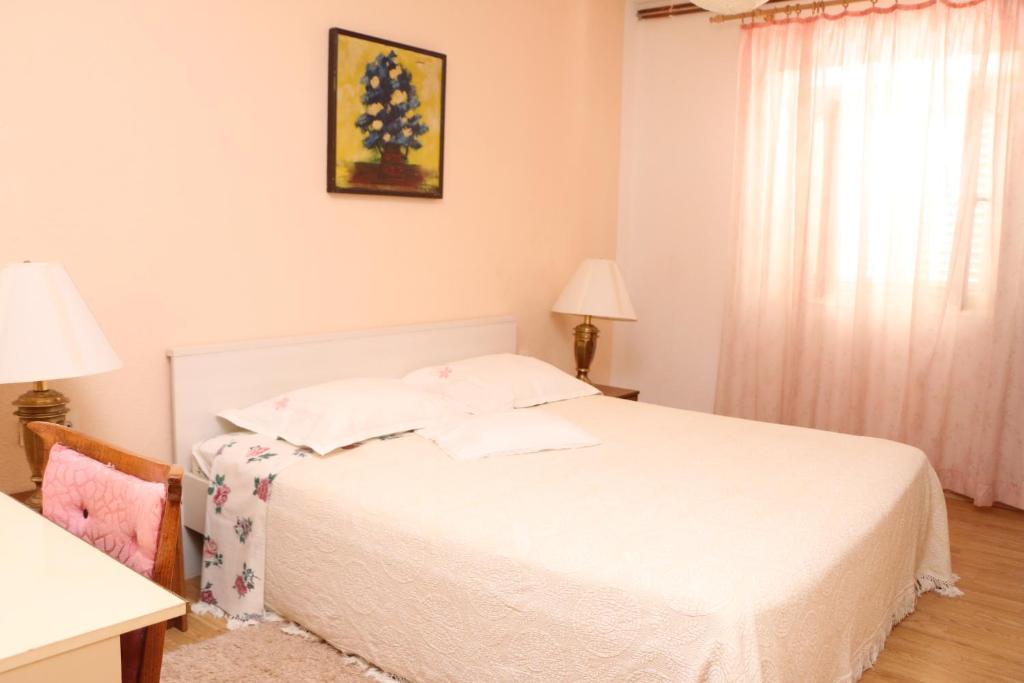 Postel nebo postele na pokoji v ubytování Apartment Grgas-Tucilo