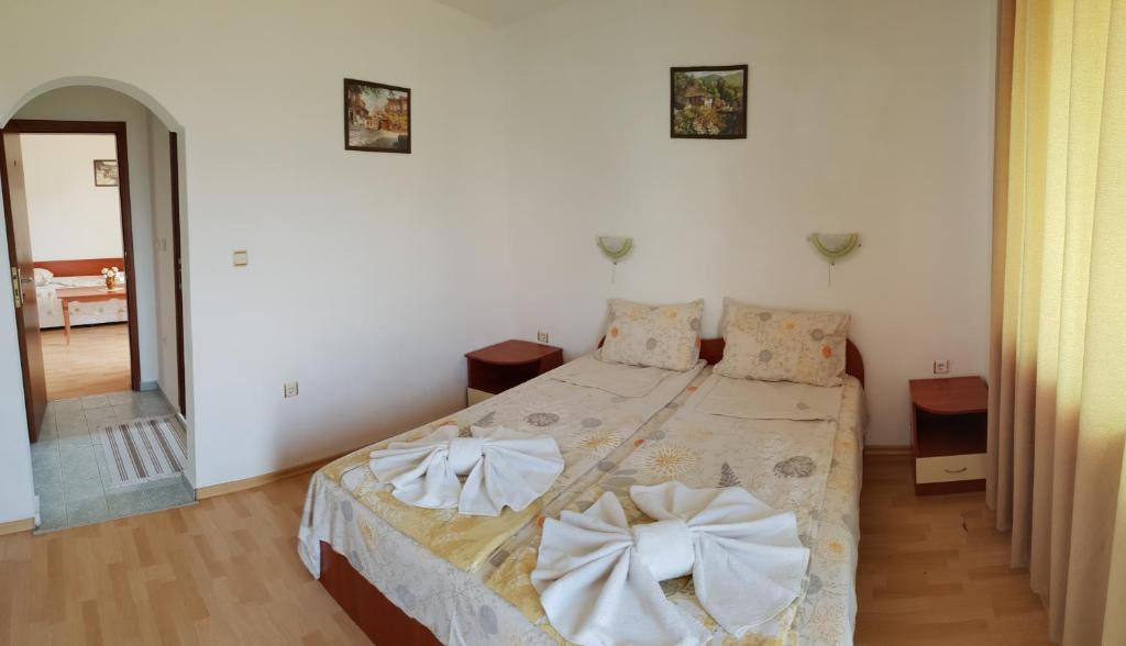 A bed or beds in a room at Hotel Strinava