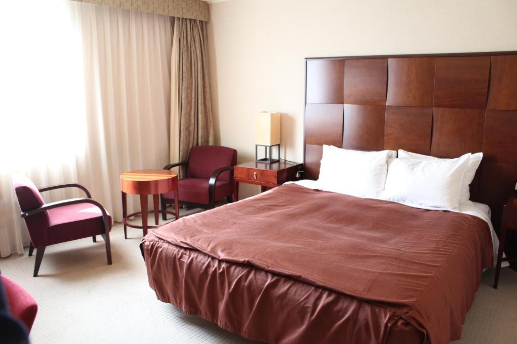 Postel nebo postele na pokoji v ubytování Hotel Lake View Mito