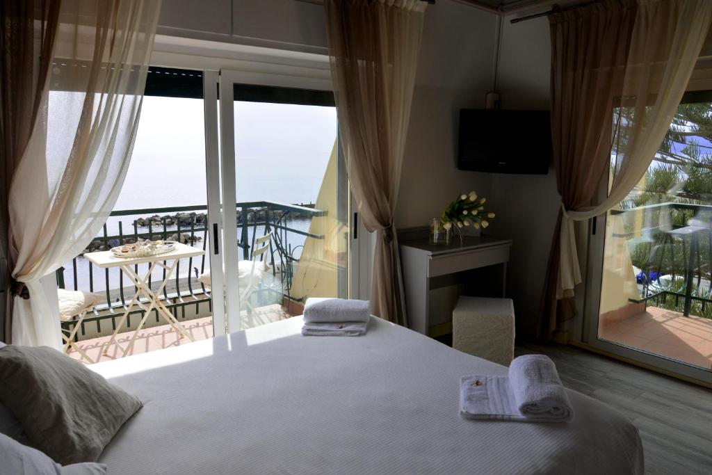 Postel nebo postele na pokoji v ubytování Hotel Zia Piera