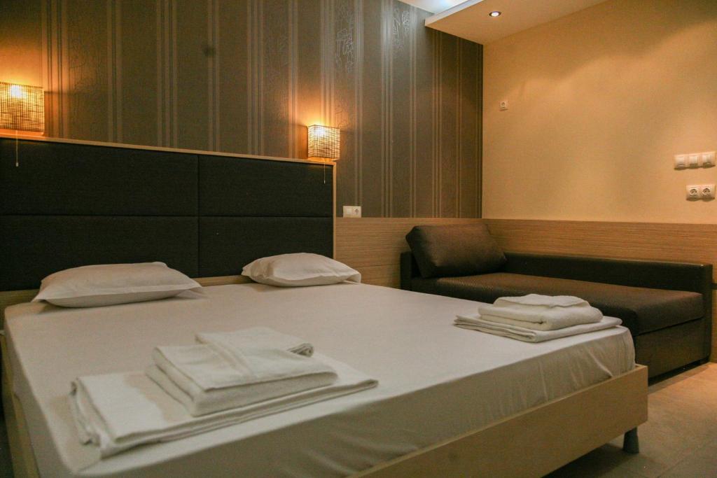 a hospital room with a bed and a chair at Apart-Hotel Onegin & Thermal Zone in Sozopol