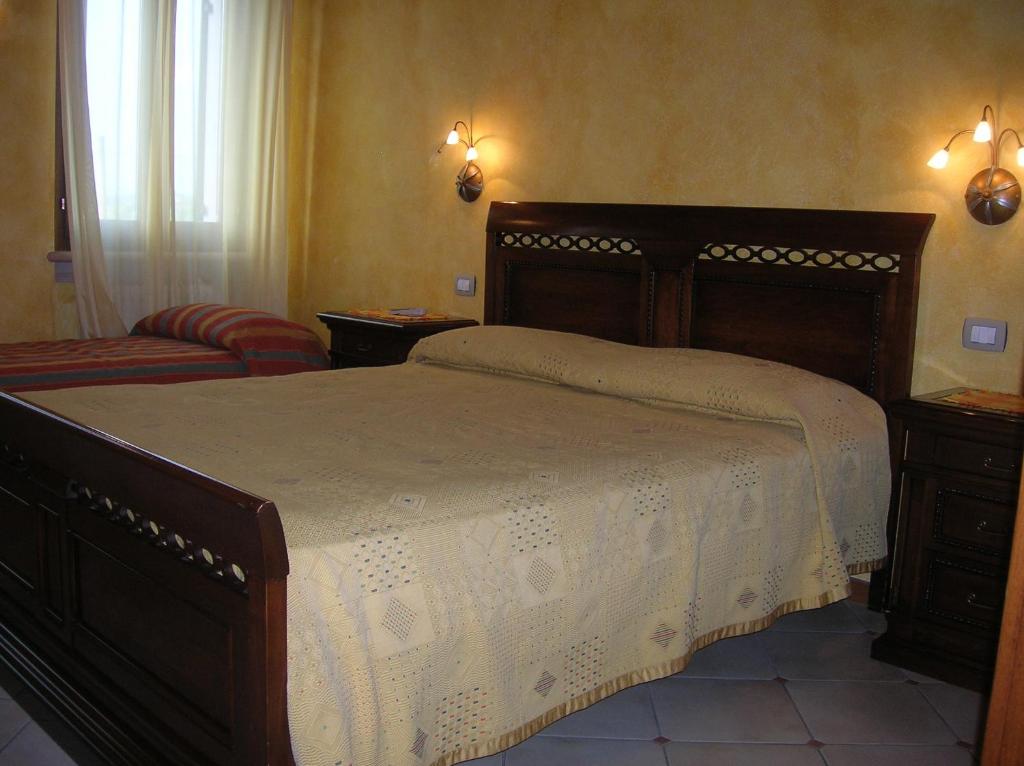 Posteľ alebo postele v izbe v ubytovaní Agriturismo Colombarola