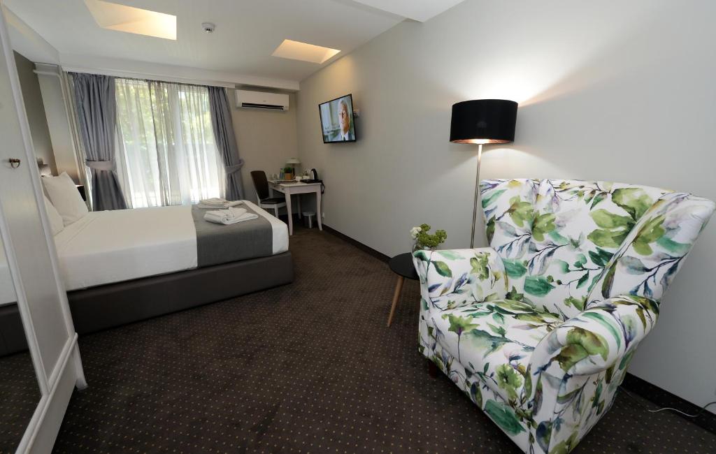 Postel nebo postele na pokoji v ubytování Hotel Alexandar II