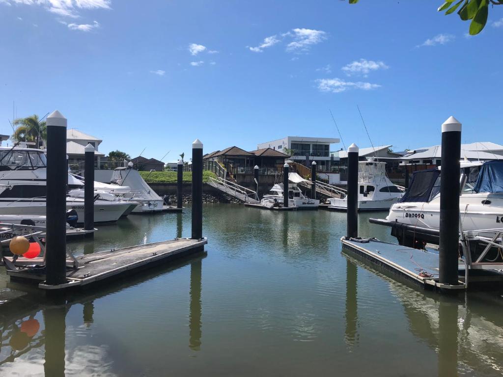 a group of boats docked at a marina at Luxury marina view Apartment cairns in Trinity Beach