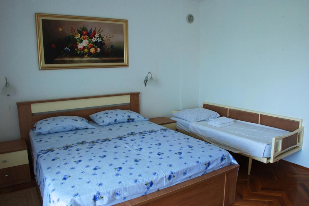 Postel nebo postele na pokoji v ubytování Nada Apartments