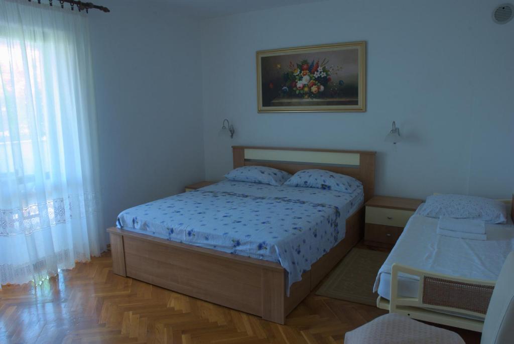 Postel nebo postele na pokoji v ubytování Nada Apartments
