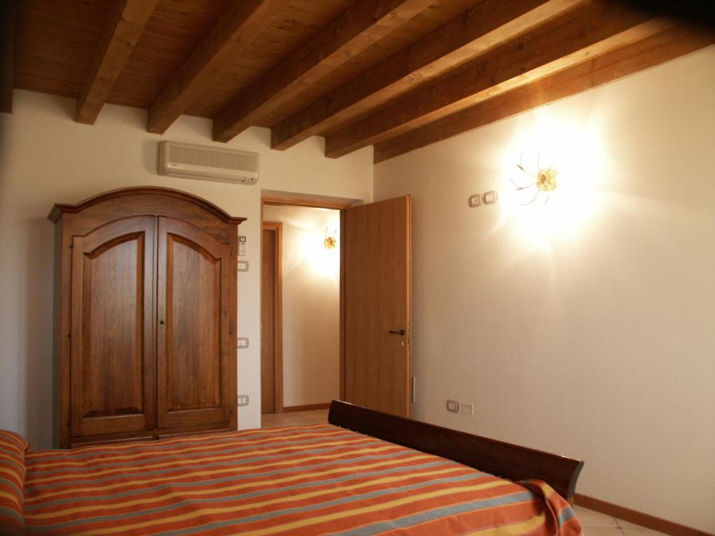 Posteľ alebo postele v izbe v ubytovaní Agriturismo Colombarola