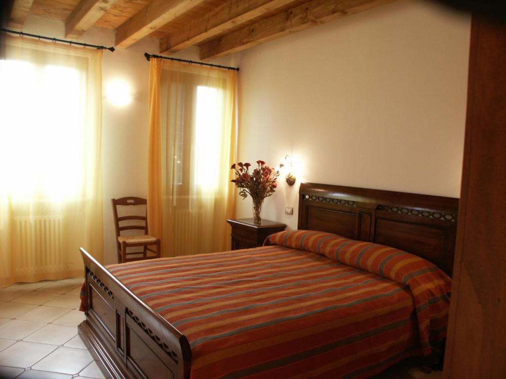 Posteľ alebo postele v izbe v ubytovaní Agriturismo Colombarola