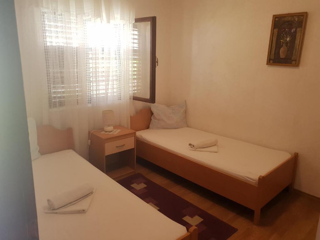 Postel nebo postele na pokoji v ubytování Guest House Alisa