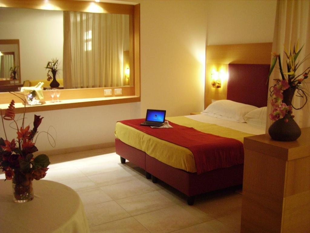 Postel nebo postele na pokoji v ubytování Hotel Degli Haethey