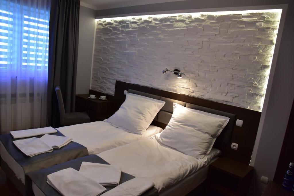 Posteľ alebo postele v izbe v ubytovaní Pokoje Restauracja Lech