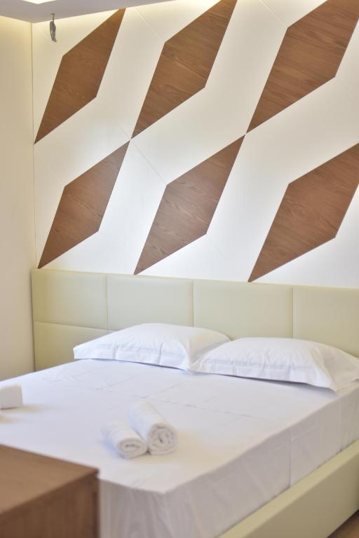 Postelja oz. postelje v sobi nastanitve Airen Hotel Velipoje