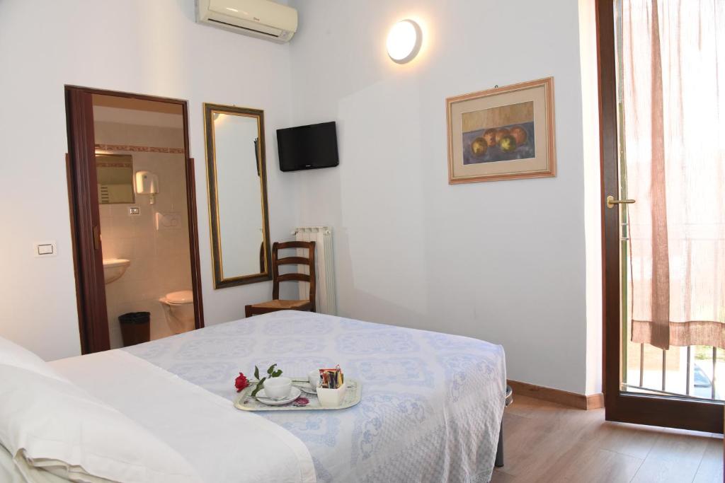 Postel nebo postele na pokoji v ubytování Albergo La Rosetta