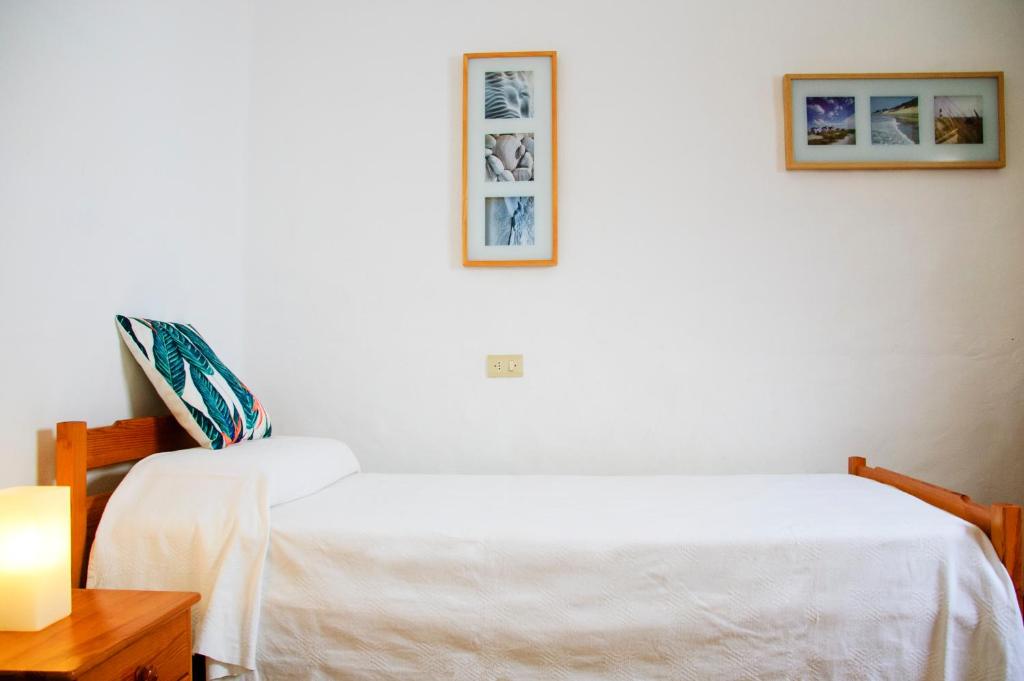 A bed or beds in a room at Seaview Risco de Famara 1
