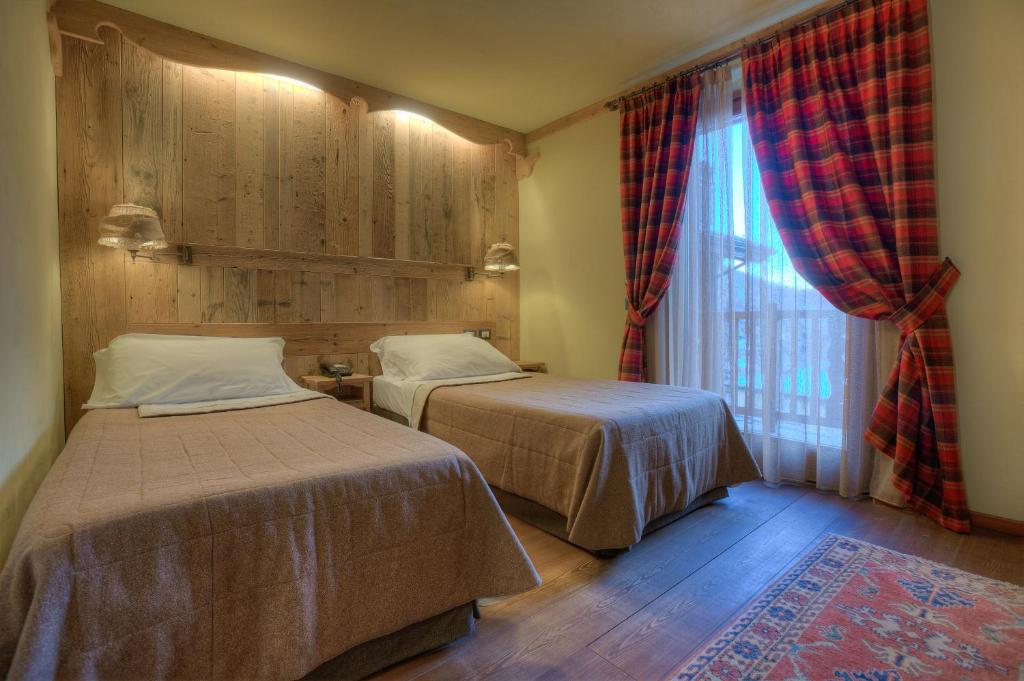 Postel nebo postele na pokoji v ubytování Hotel Meublé Mon Rêve